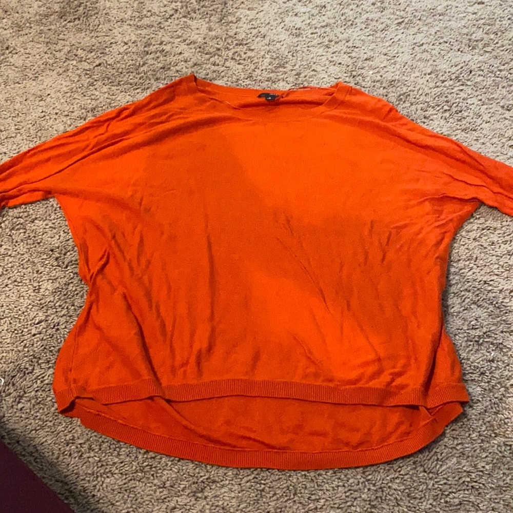 High low orange light sweater